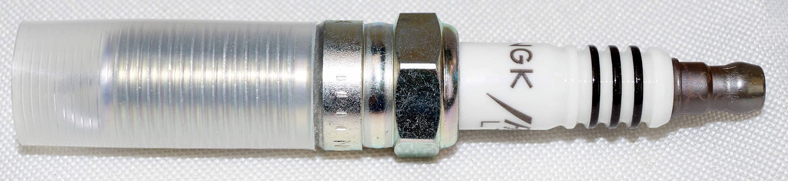 NGK genuine parts packaging and hardware included in the set