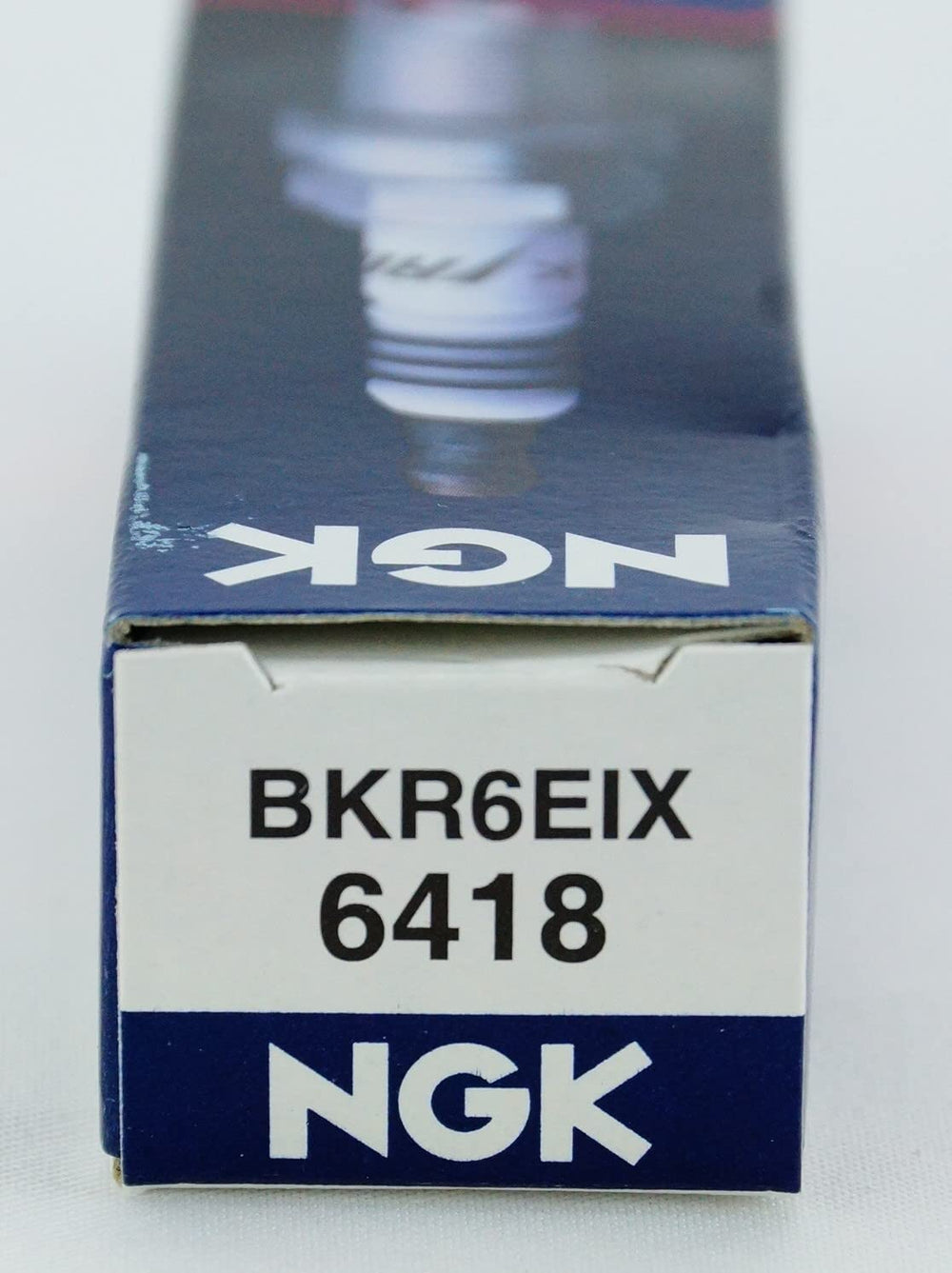 4-pack NGK Iridium IX spark plugs ready for vehicle installation.