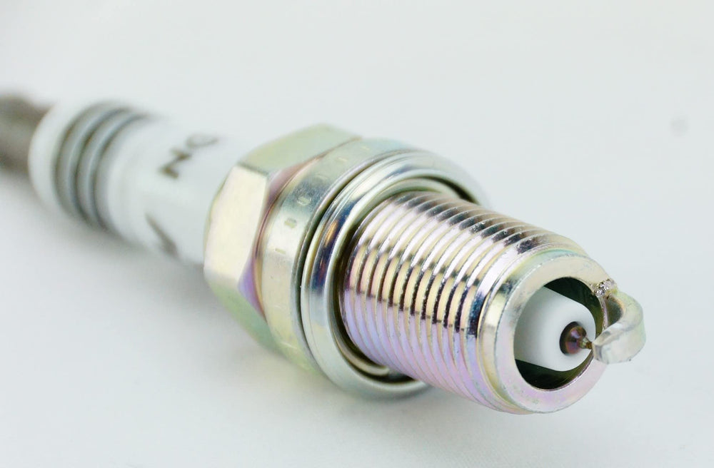 NGK Iridium IX 6418 showing robust shell for long-lasting sparking performance.