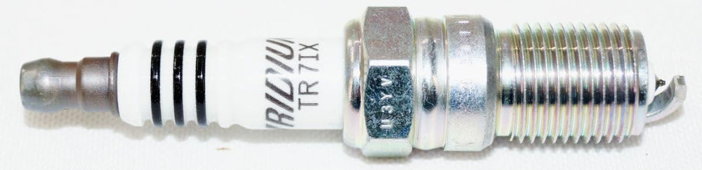 NGK TR7IX spark plug threads and base detail emphasizing precision machining