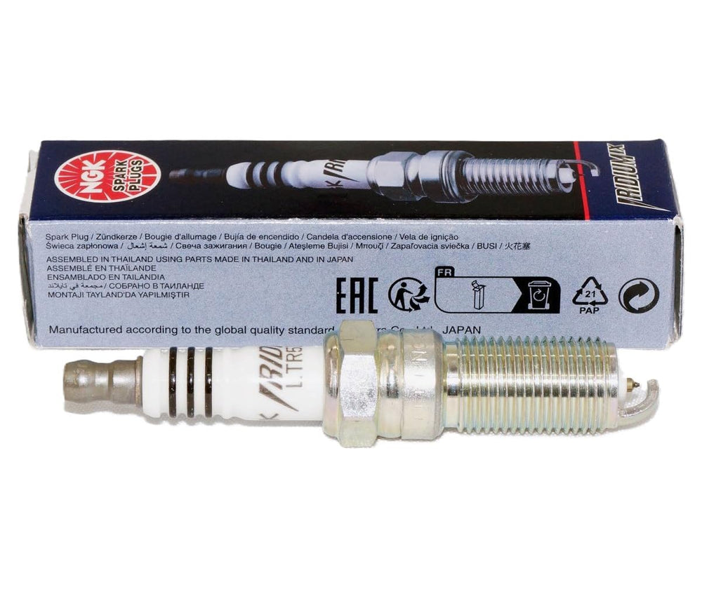 Close-up of NGK Iridium IX spark plug tip showing precision electrodes
