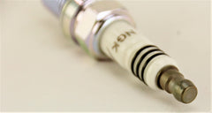 NGK iridium spark plug close-up tip, durable and precise