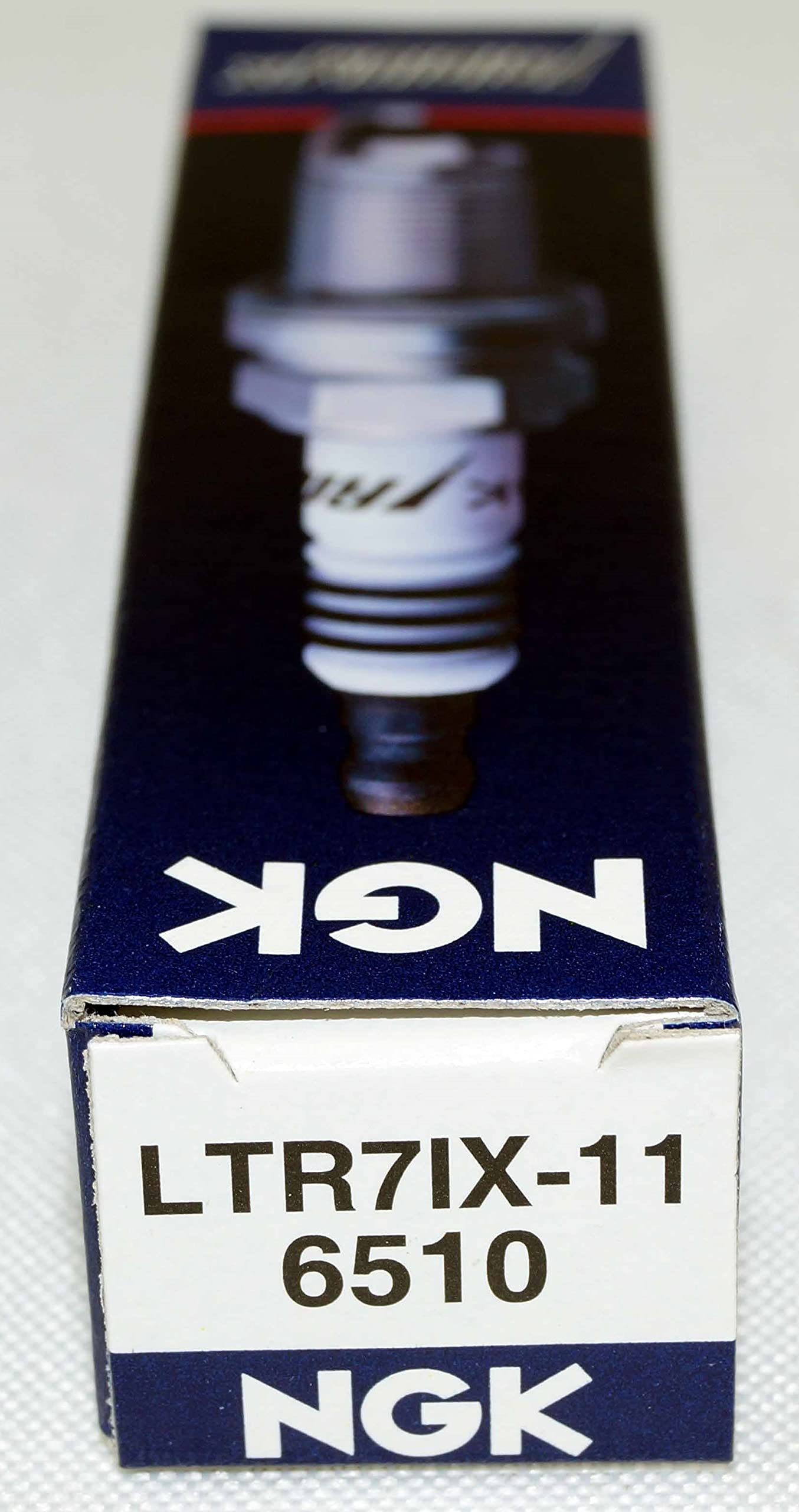 NGK LTR7IX-11 spark plug close-up with ceramic insulator detail