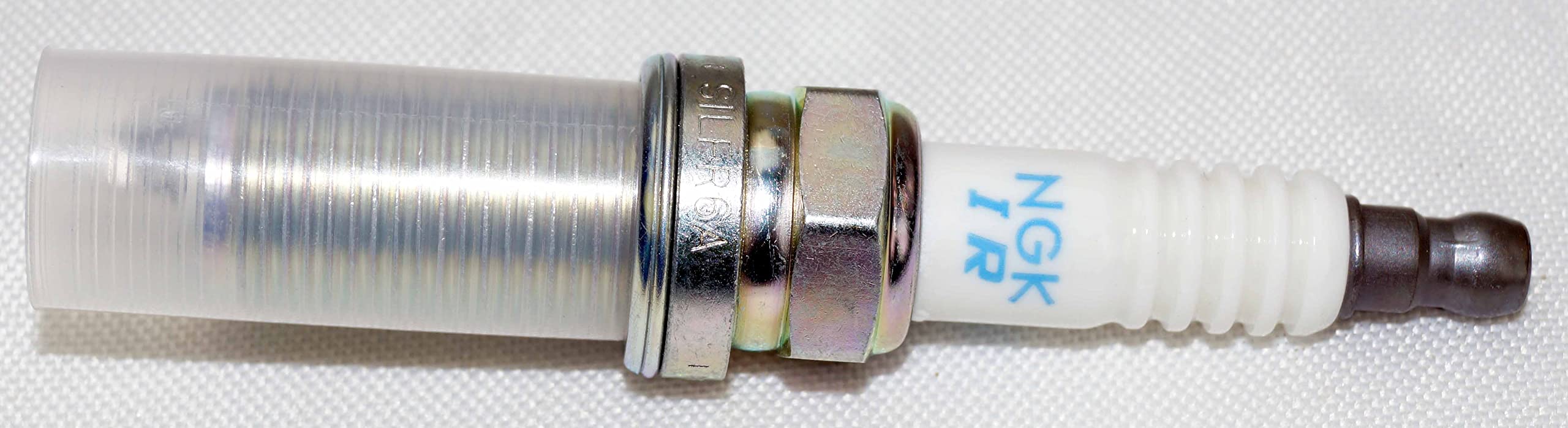NGK spark plug with included hardware for easy installation