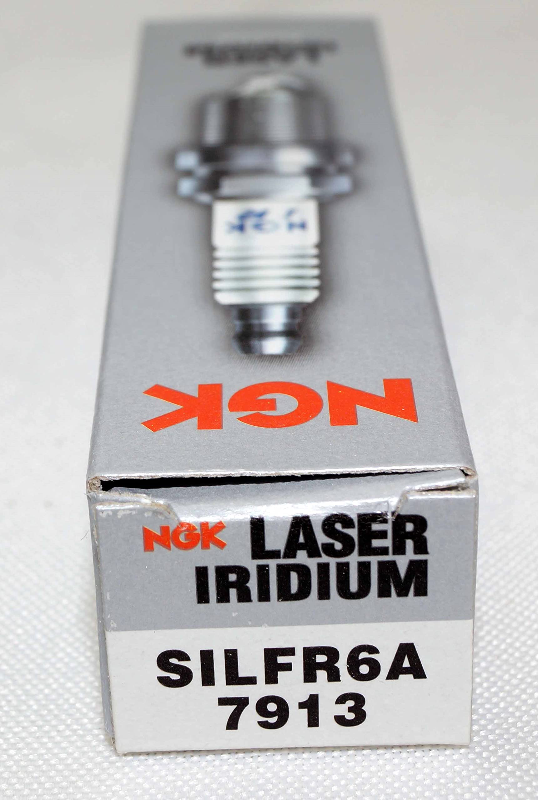 NGK spark plug packaging showing authenticity and guaranteed parts
