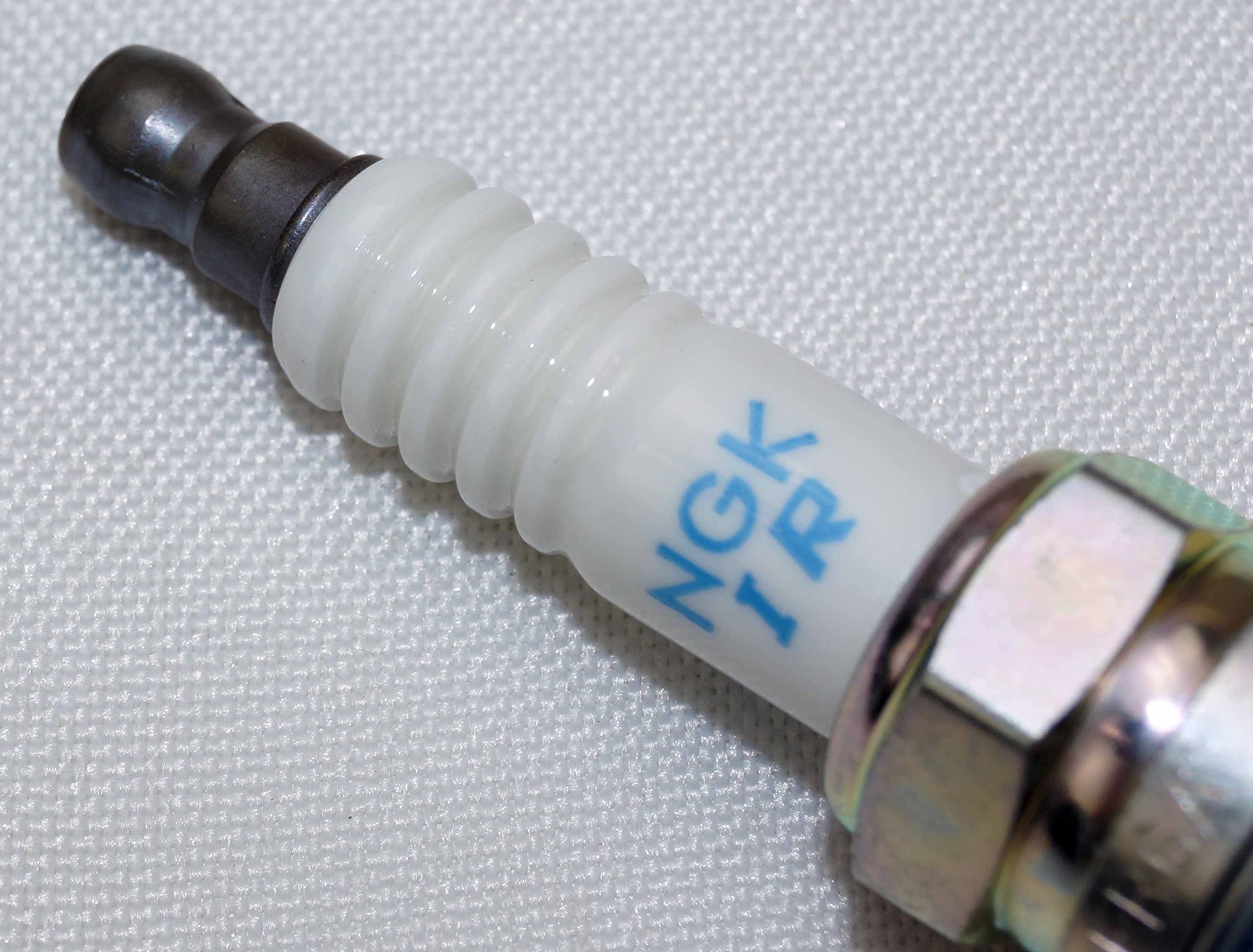 NGK four-pack supports spare plugs for maintenance planning