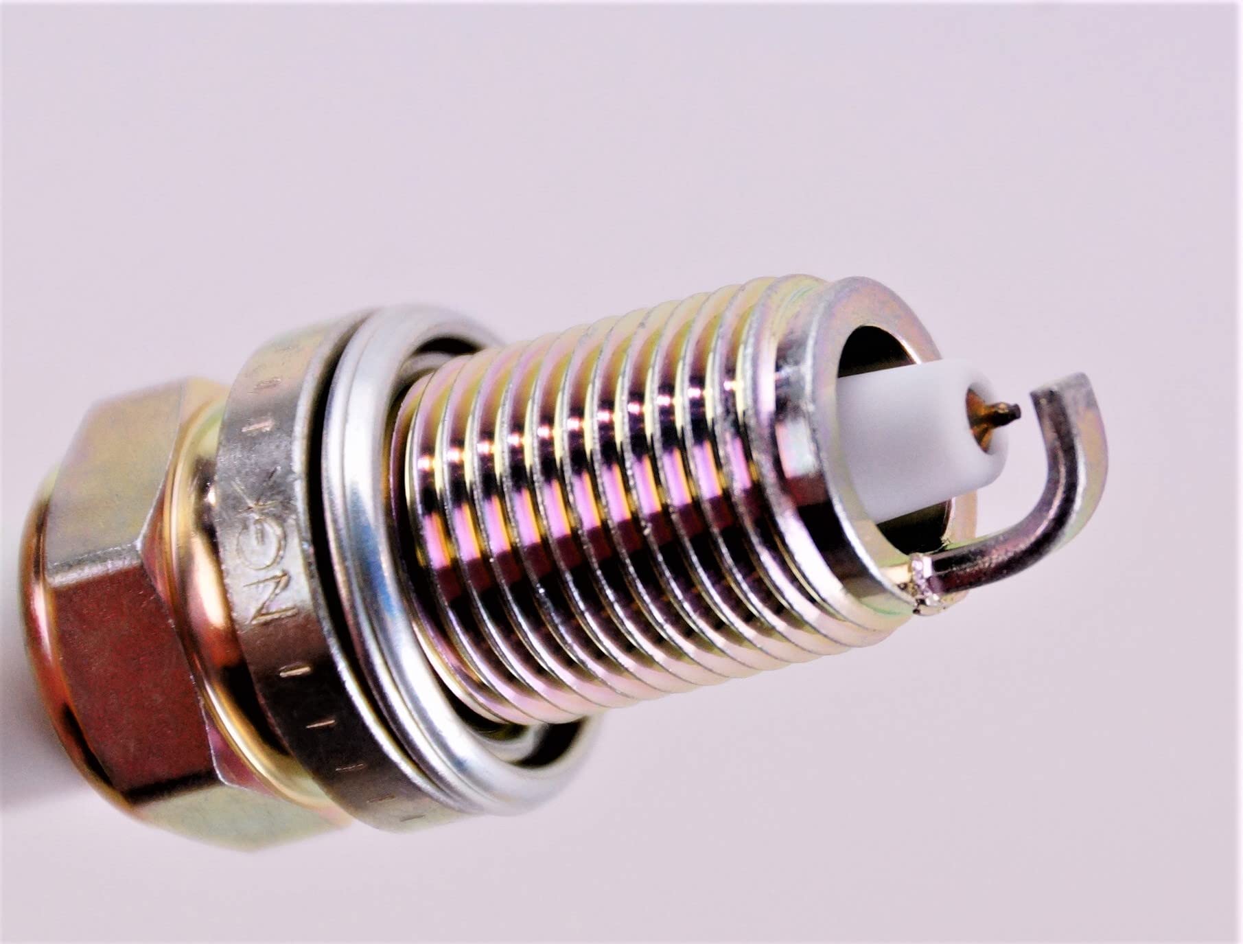 NGK 7100 ZFR6FGP in packaging shows direct replacement compatibility for many vehicles