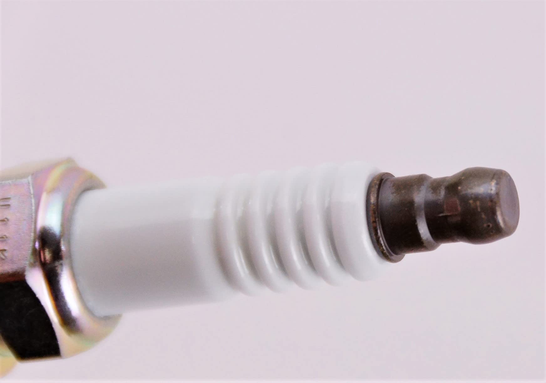 NGK spark plug 7100 ZFR6FGP in-use illustration suggests easy installation
