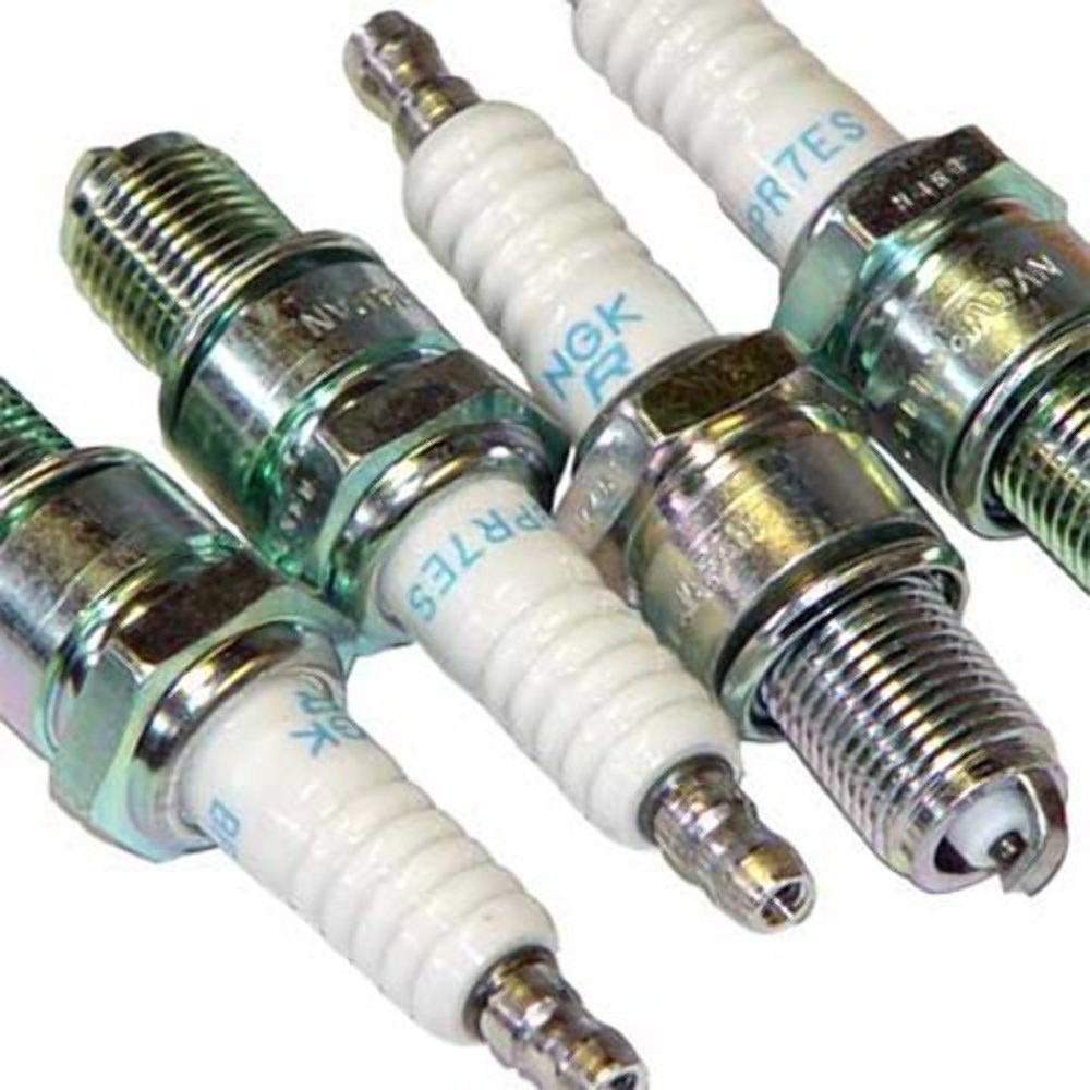 NGK 7131-4PK spark plug side view shows dual ground electrodes for consistency
