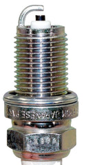 NGK BKR5E-11 spark plug threads and seating shown for secure fit.