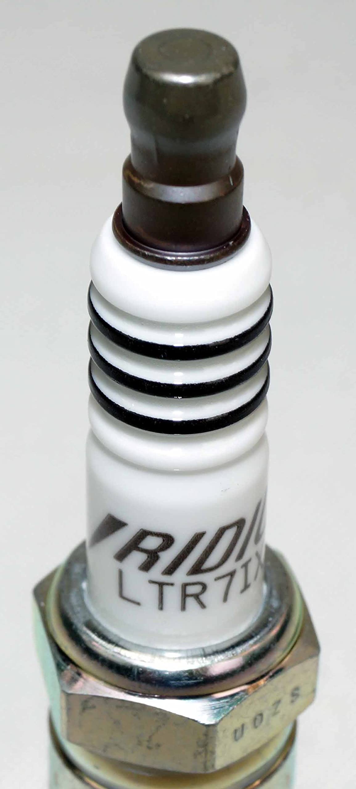 NGK spark plug eight-pack neatly arranged for storage and inventory