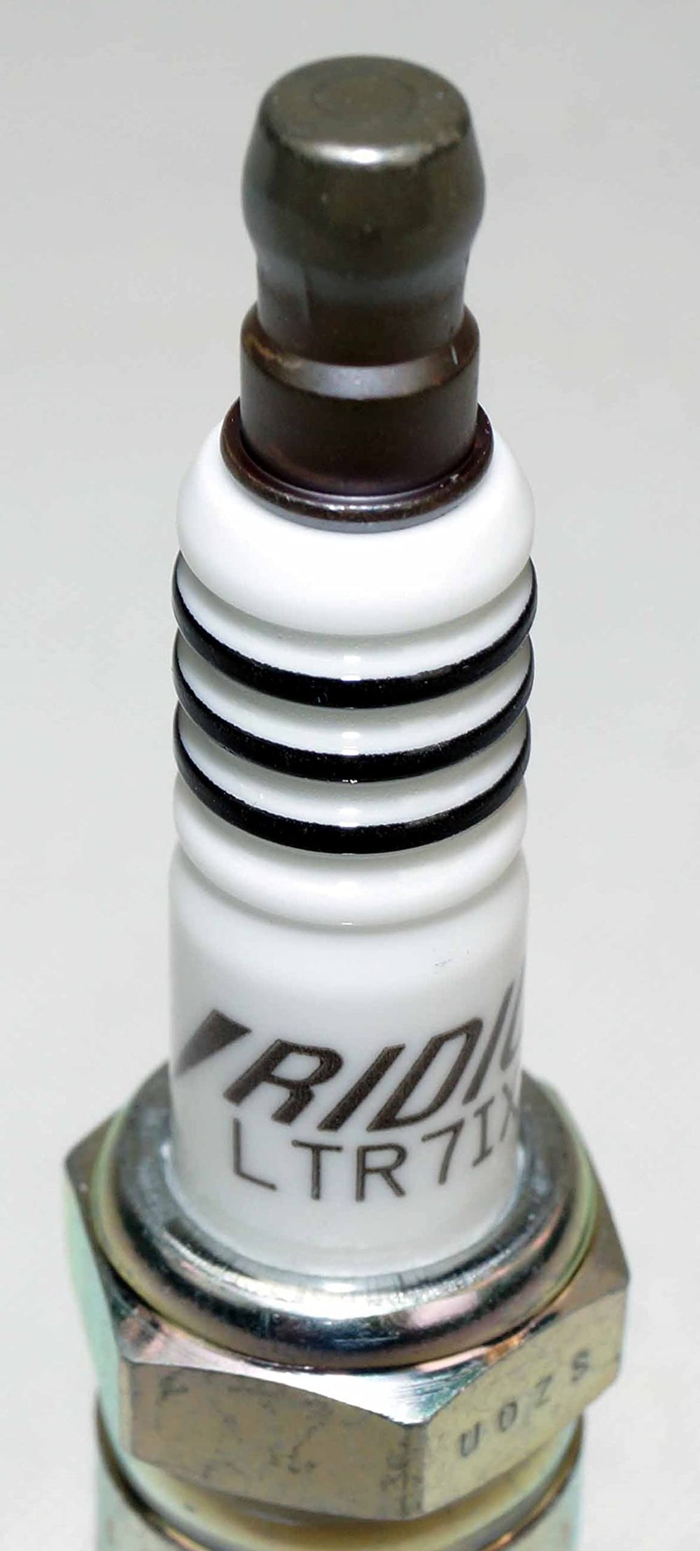 NGK spark plug eight-pack neatly arranged for storage and inventory