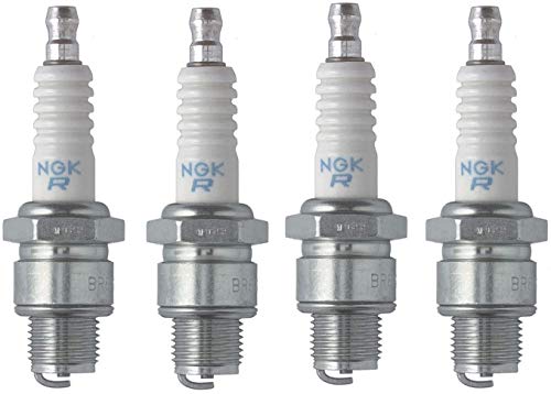 NGK spark plugs installed in engine compartment for dependable performance.