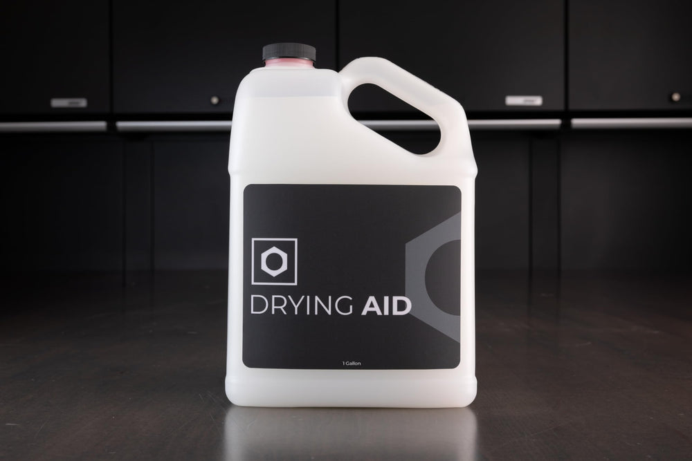 32 oz Obsessed Garage Drying Aid bottle beside wax and ceramic coating labels