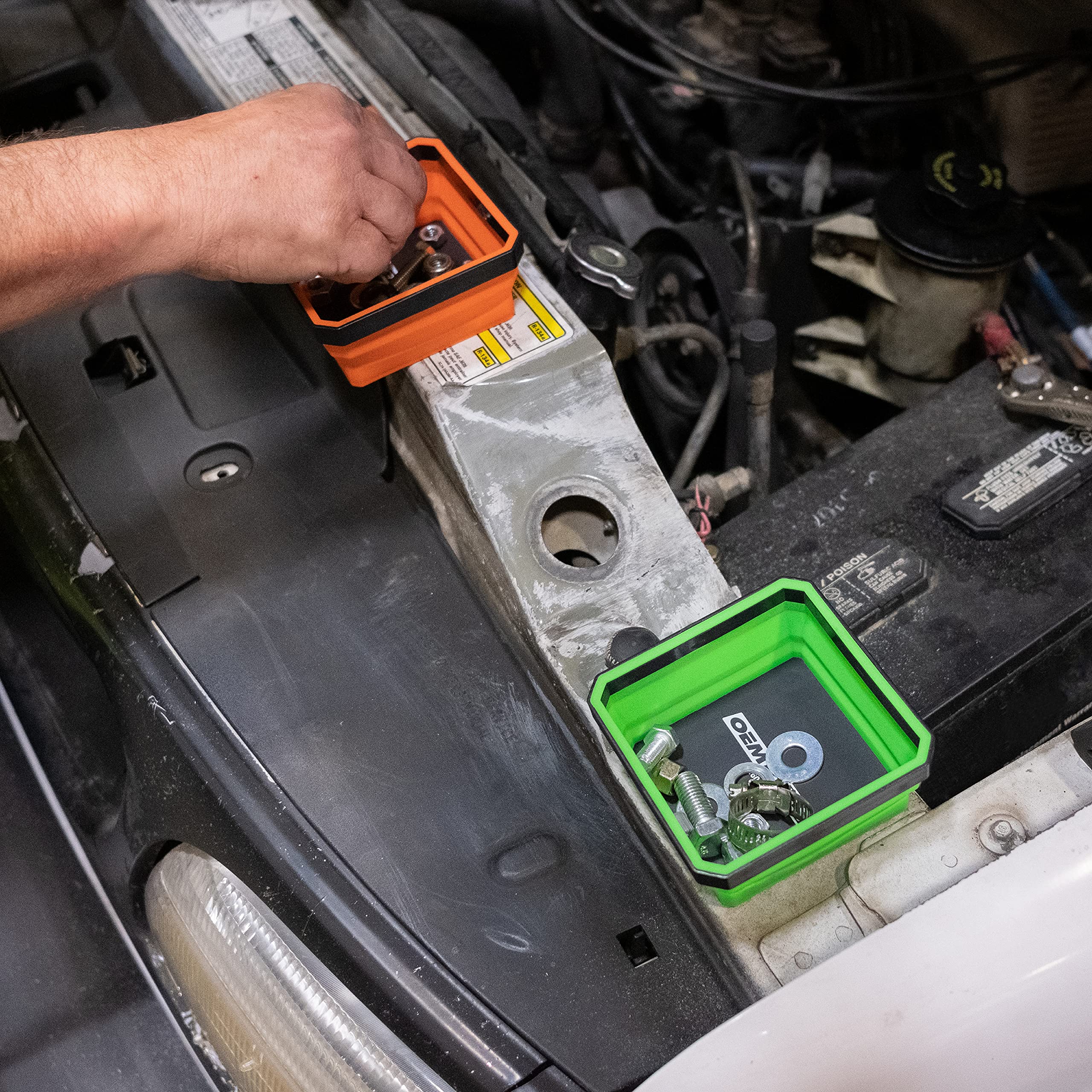 OEMTOOLS automotive repair scenario with bolts, nuts, and clips neatly organized