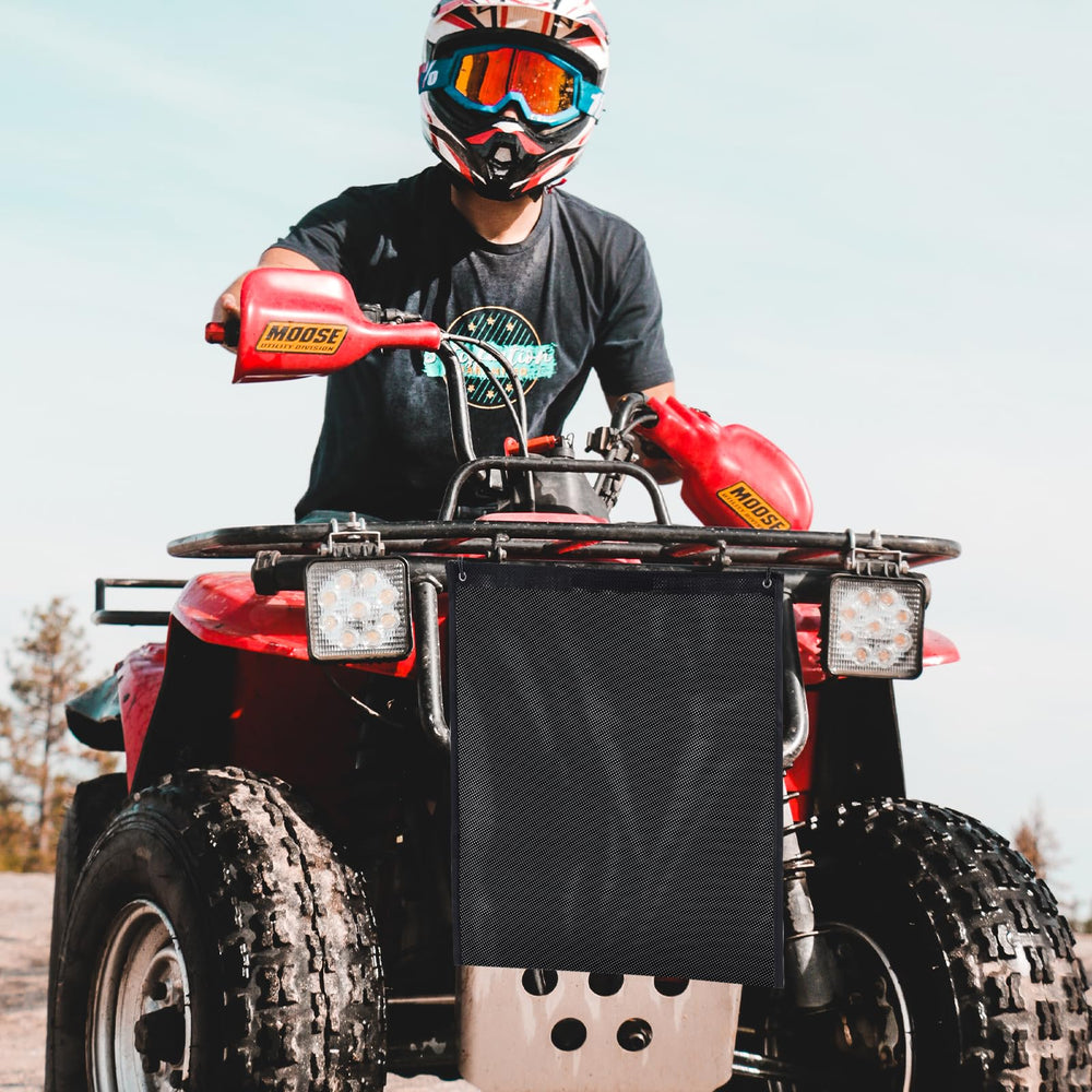 OIEKUN UTV mesh trash bag two-pack in use on a forest trail.