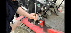 OKYOUK Zerk cleaning tool in on-site use for hardened grease maintenance