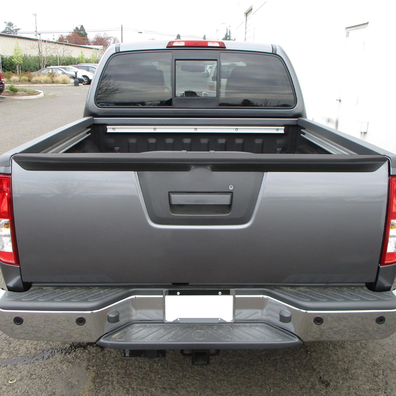 olltoz rear-tailgate molding cap on Frontier showcasing refined finish and fit.
