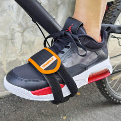 ONIPAX pedal strap on the right side showing quick adjustment.