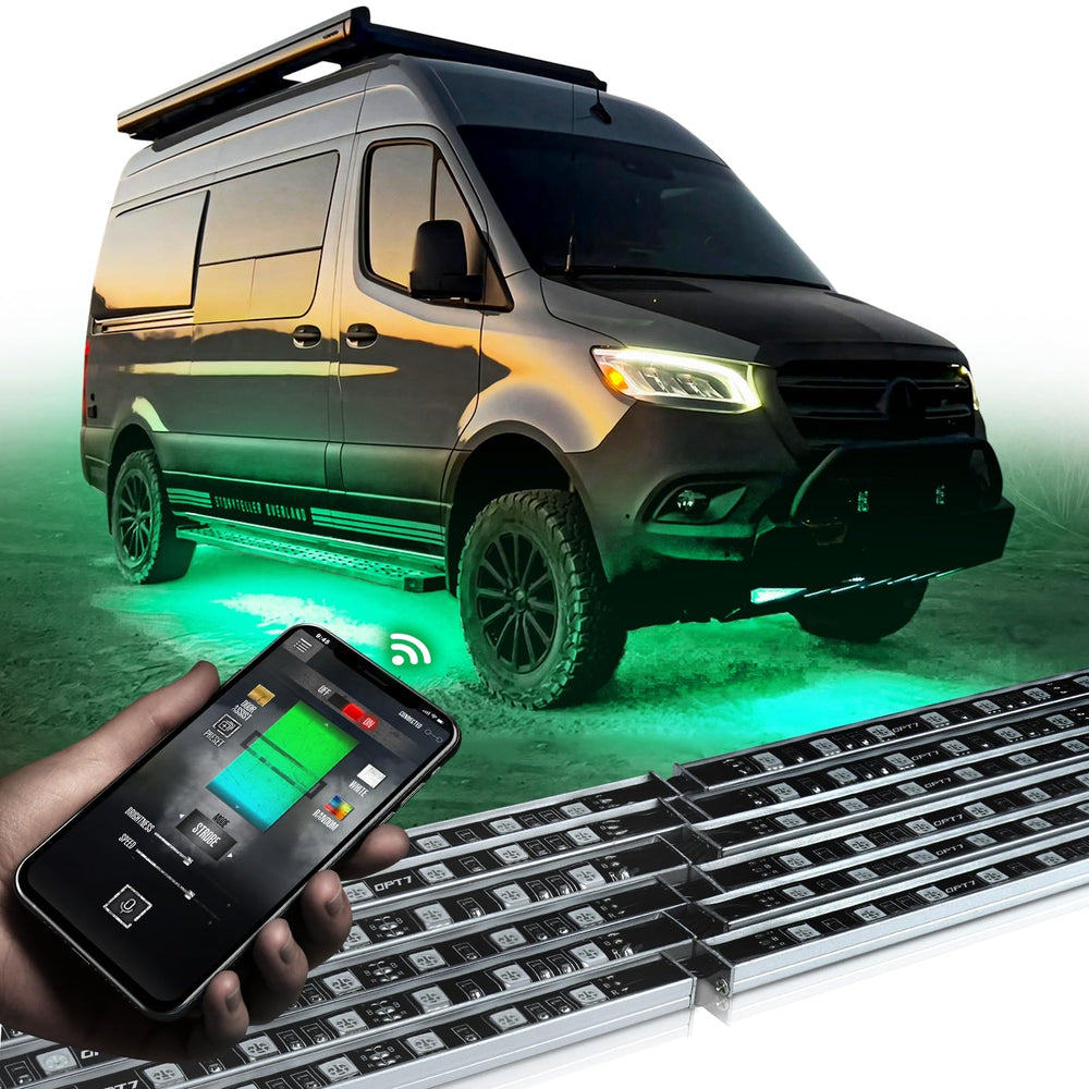 OPT7 Aura Pro RV underbody light bar illuminates campsite with vivid RGB colors.