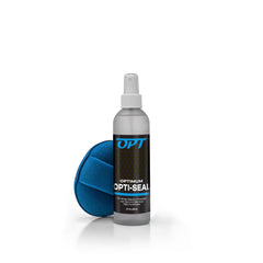 Optimum Opti-Seal spray bottle close-up applying a protective coating to automotive paint.