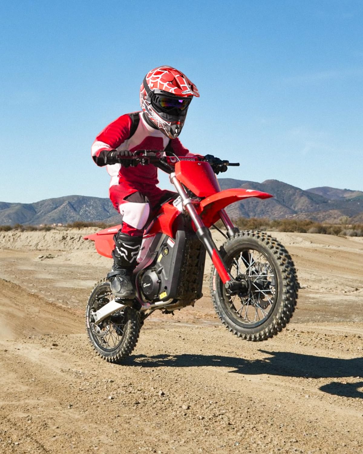Oumurs youth helmet set with gloves and goggles for active riders.