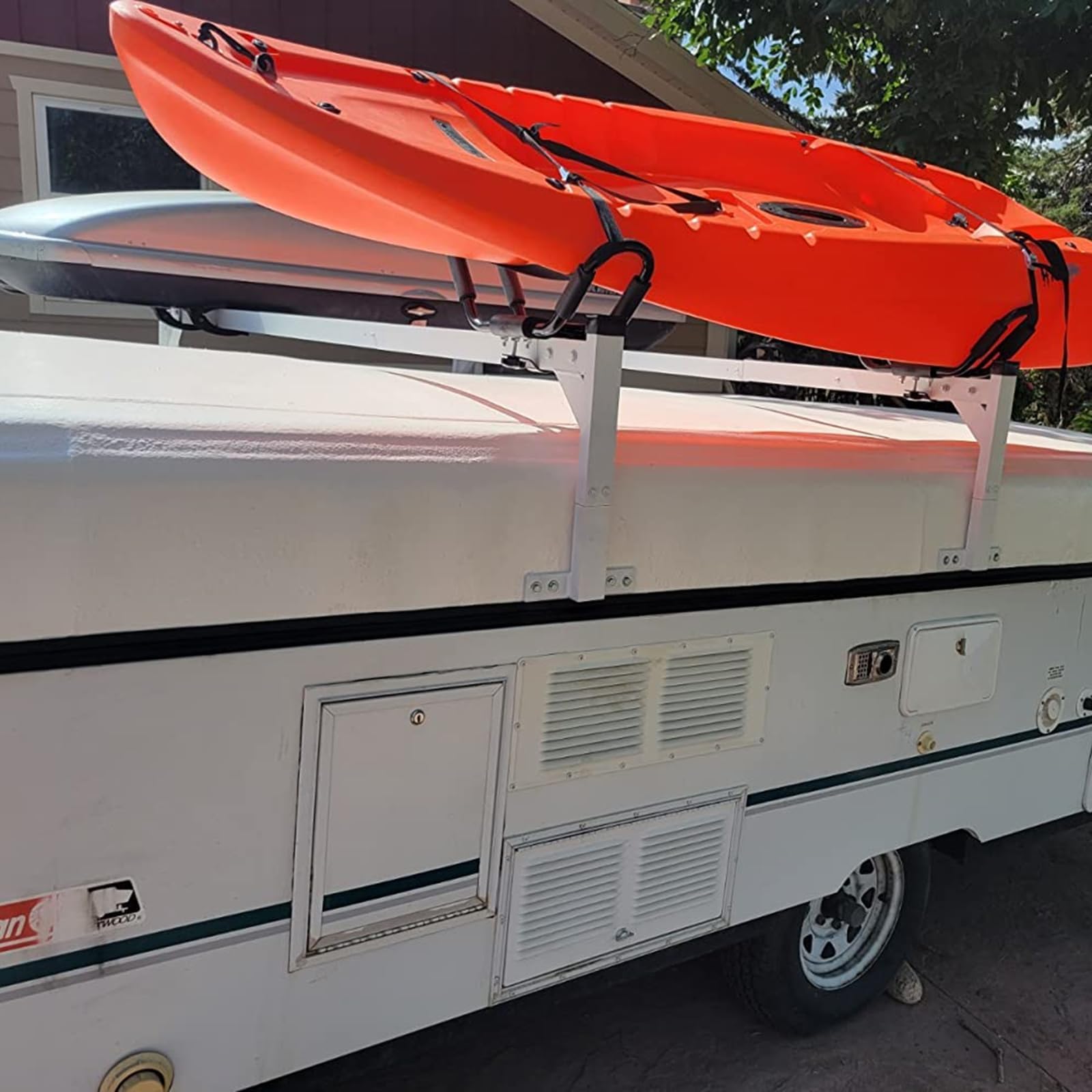 OUTPRIZE trailer ladder rack on an enclosed trailer enables efficient transport.