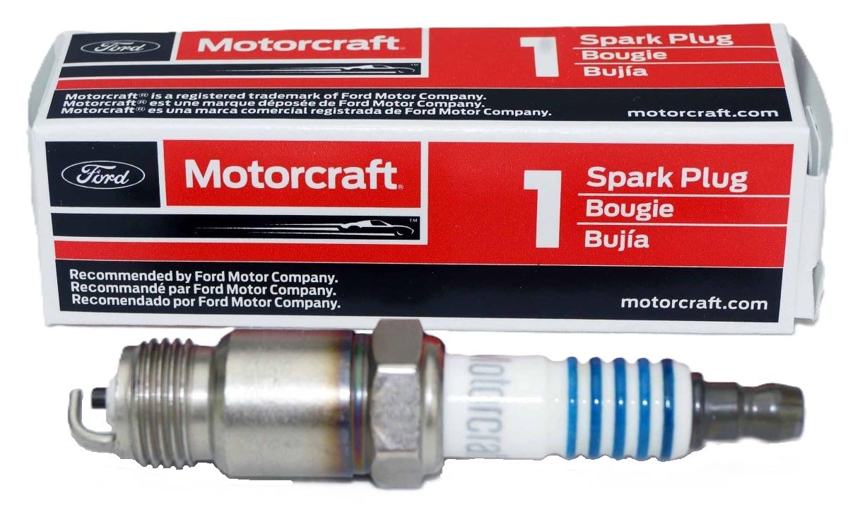 SP450X ASF42CX spark plug close-up showing robust metal threading and ceramic insulator