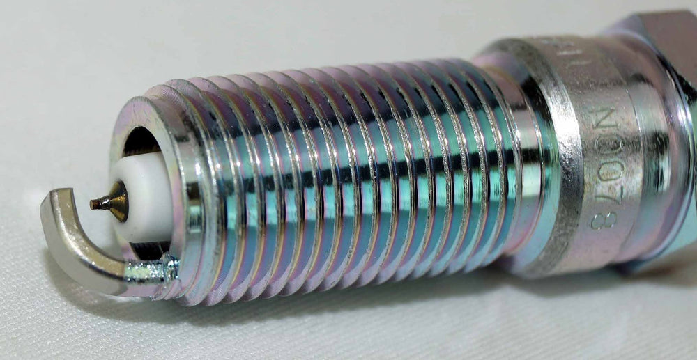 OverstockDirect SP530X iridium spark plugs packaging shot, four-pack ready for installation