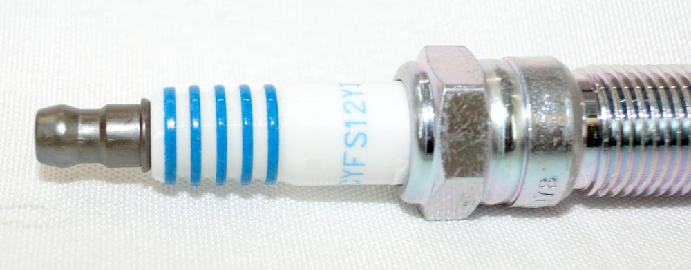 OverstockDirect SP580X iridium spark plug close-up with precise electrode design