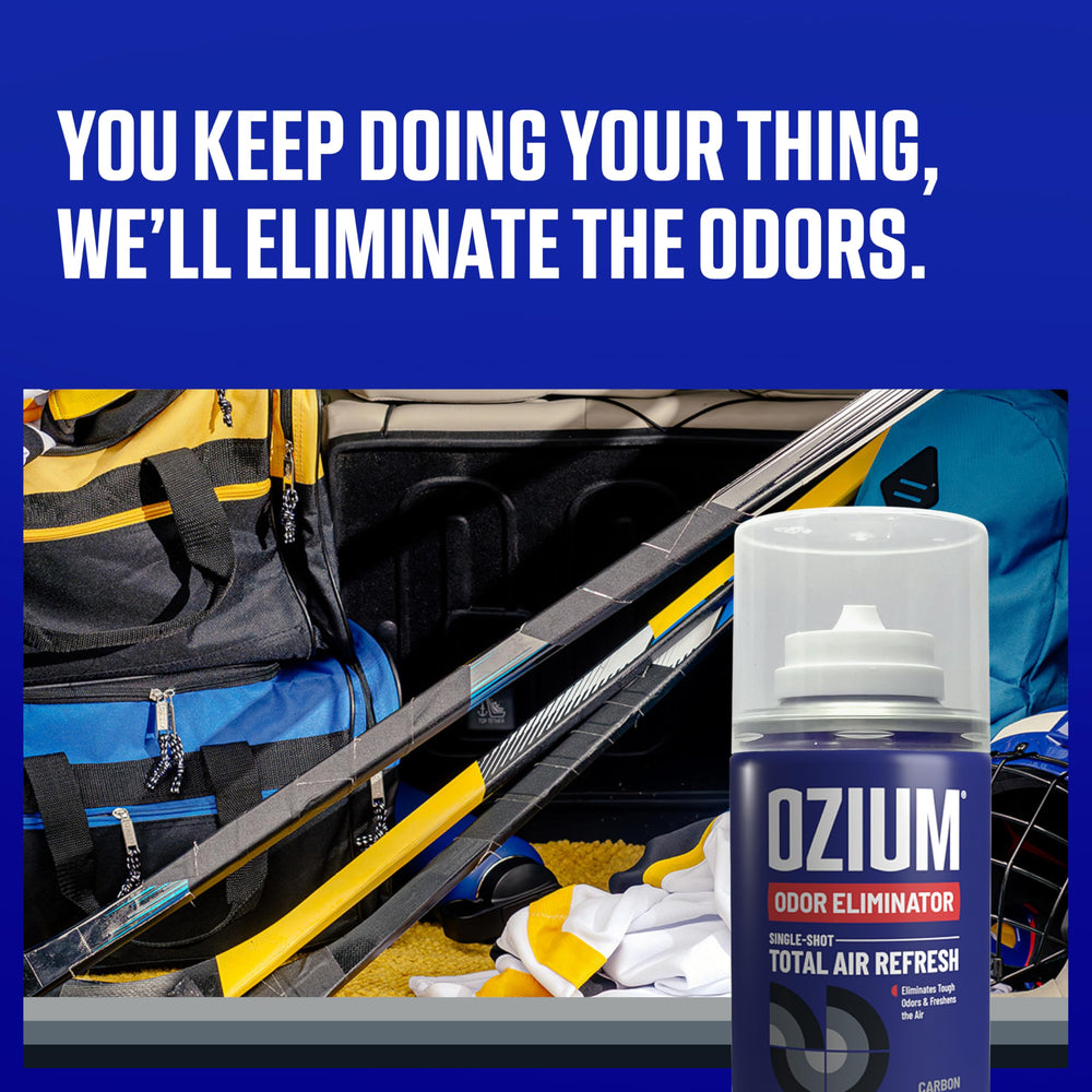 Ozium bottle dispensing action in car showing quick odor control