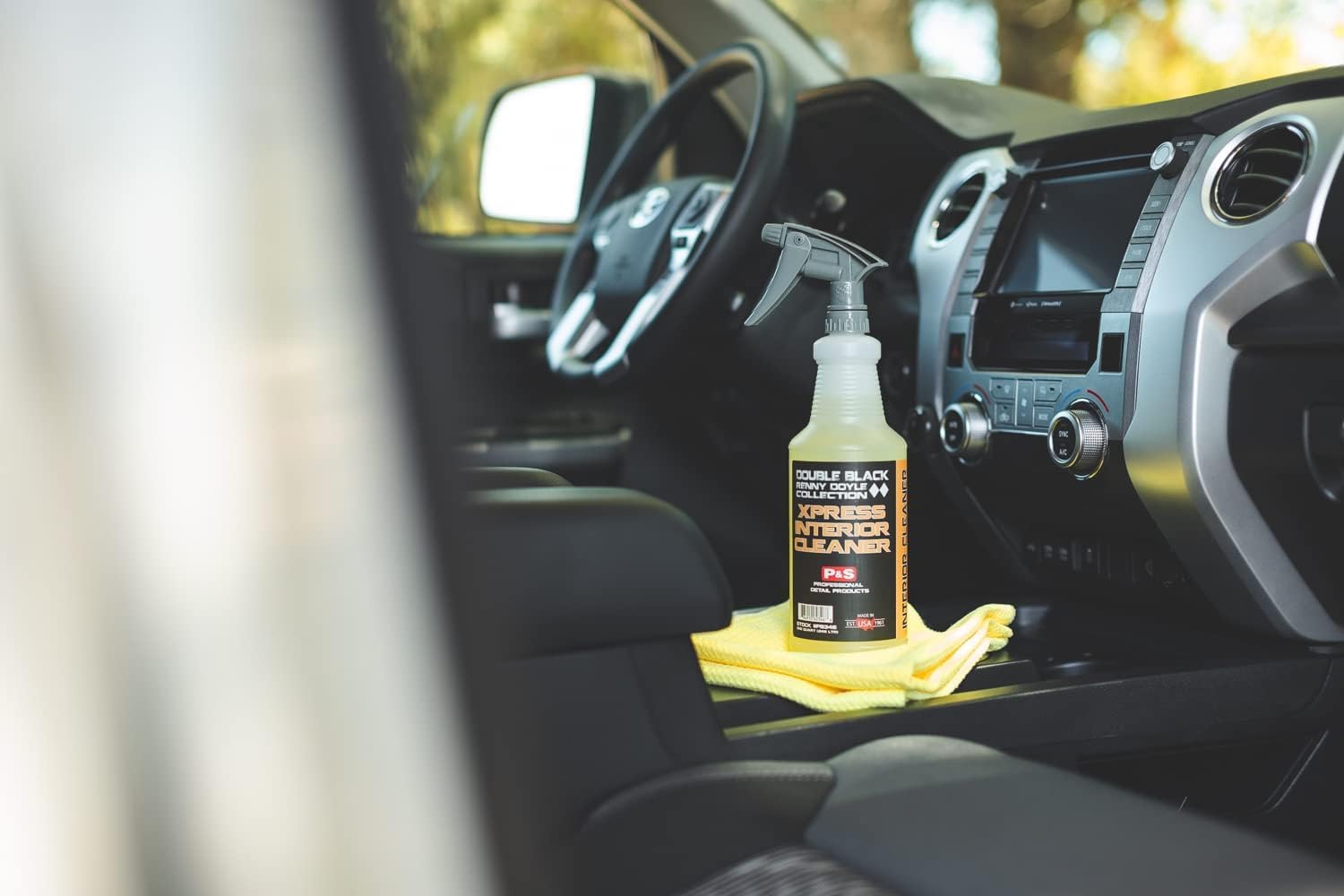 P & S Xpress Interior Cleaner on leather surface, gentle cleaning without damage.