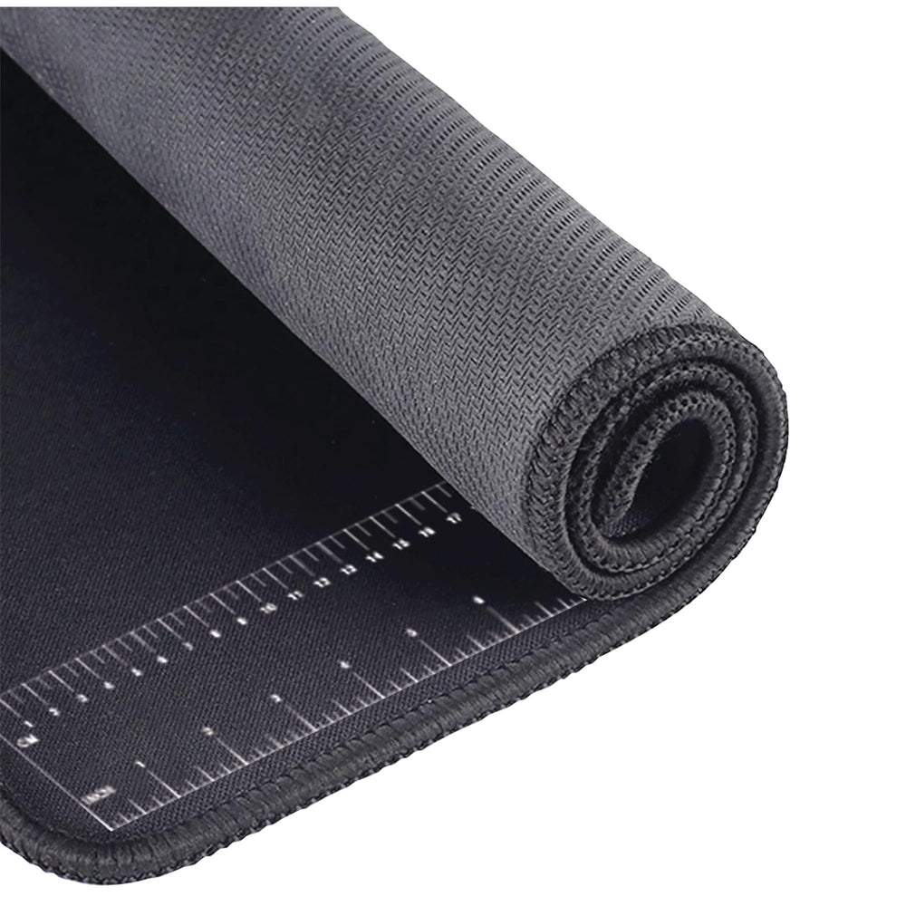 Chemical-resistant surface of Performance Tool neoprene mat protecting the workspace