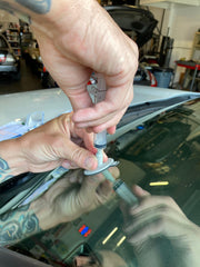 Repairs bullseye damage up to one and a quarter inches with Permatex.