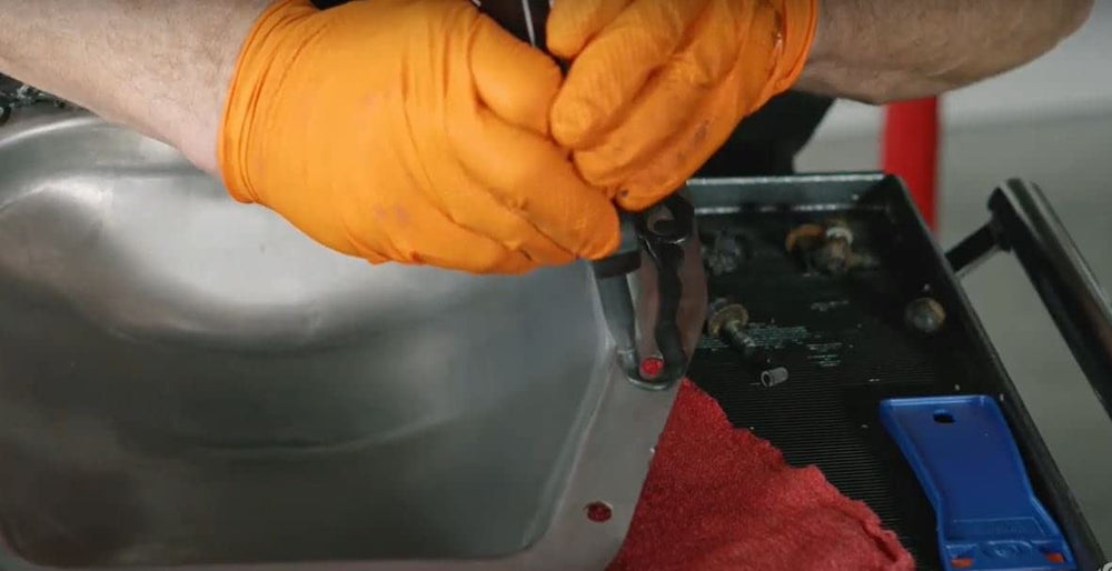Permatex Ultra Black valve-cover seal applied to maintain flexible oil seals