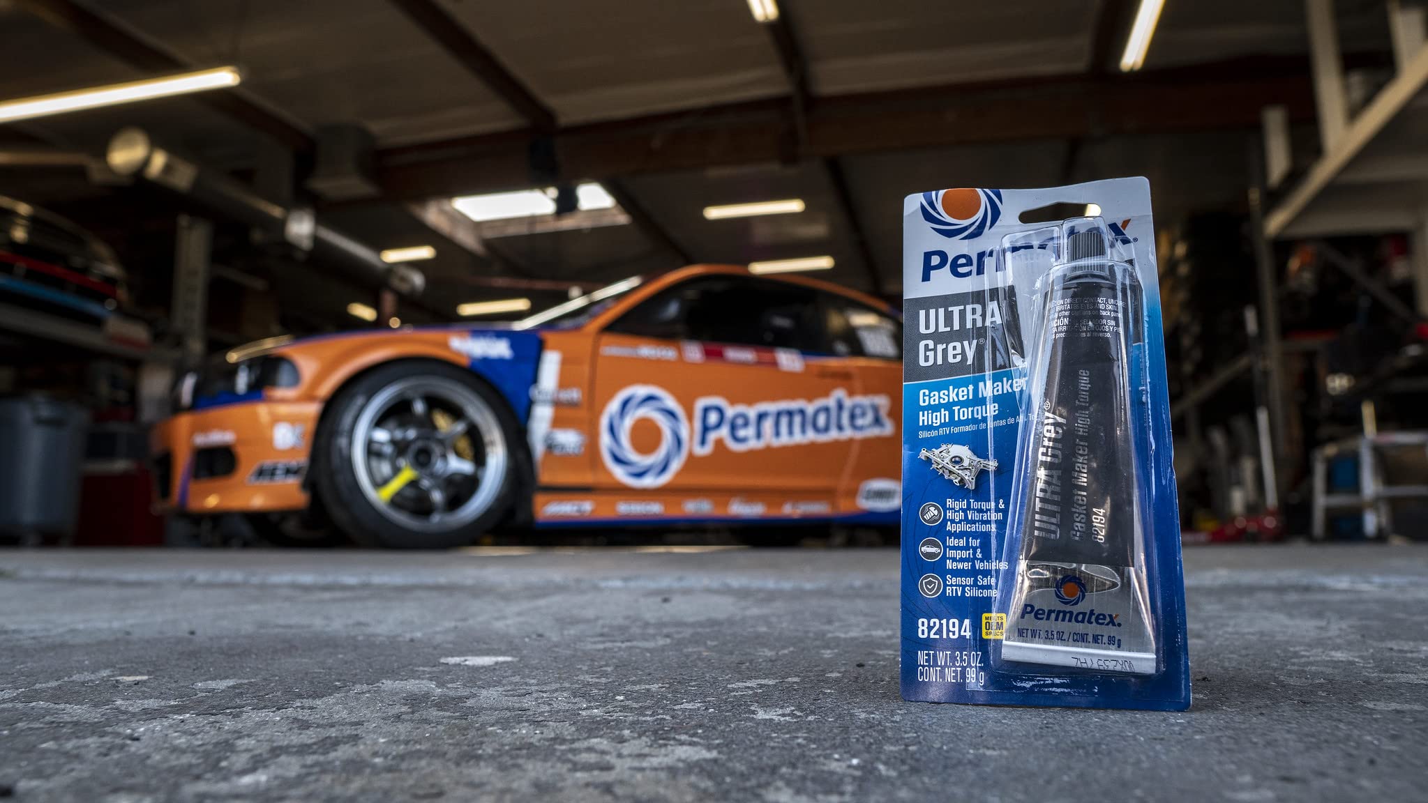 Permatex Ultra Grey bead applied to timing cover for vibration resistance
