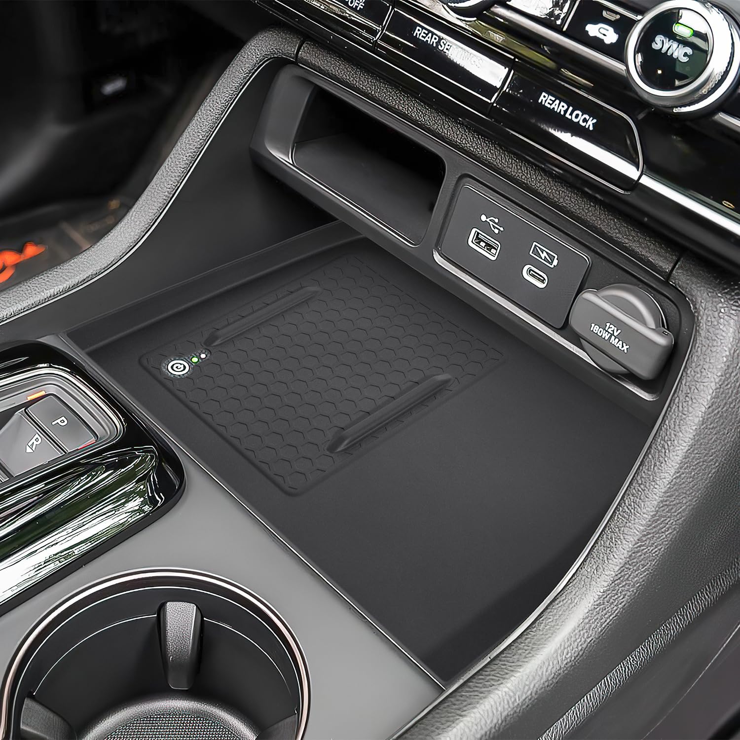 PIMCAR wireless charging pad integrated into center console mat for easy charging.