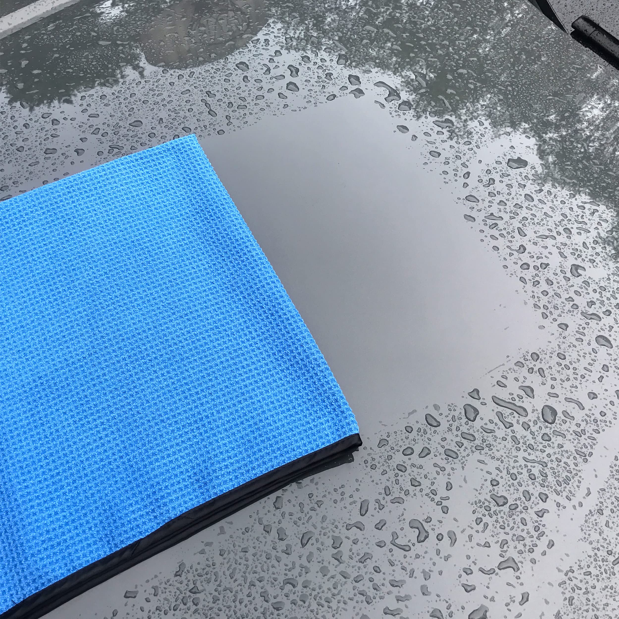 POLYTE Elite 16x24 blue drying towel folded for versatile storage and use