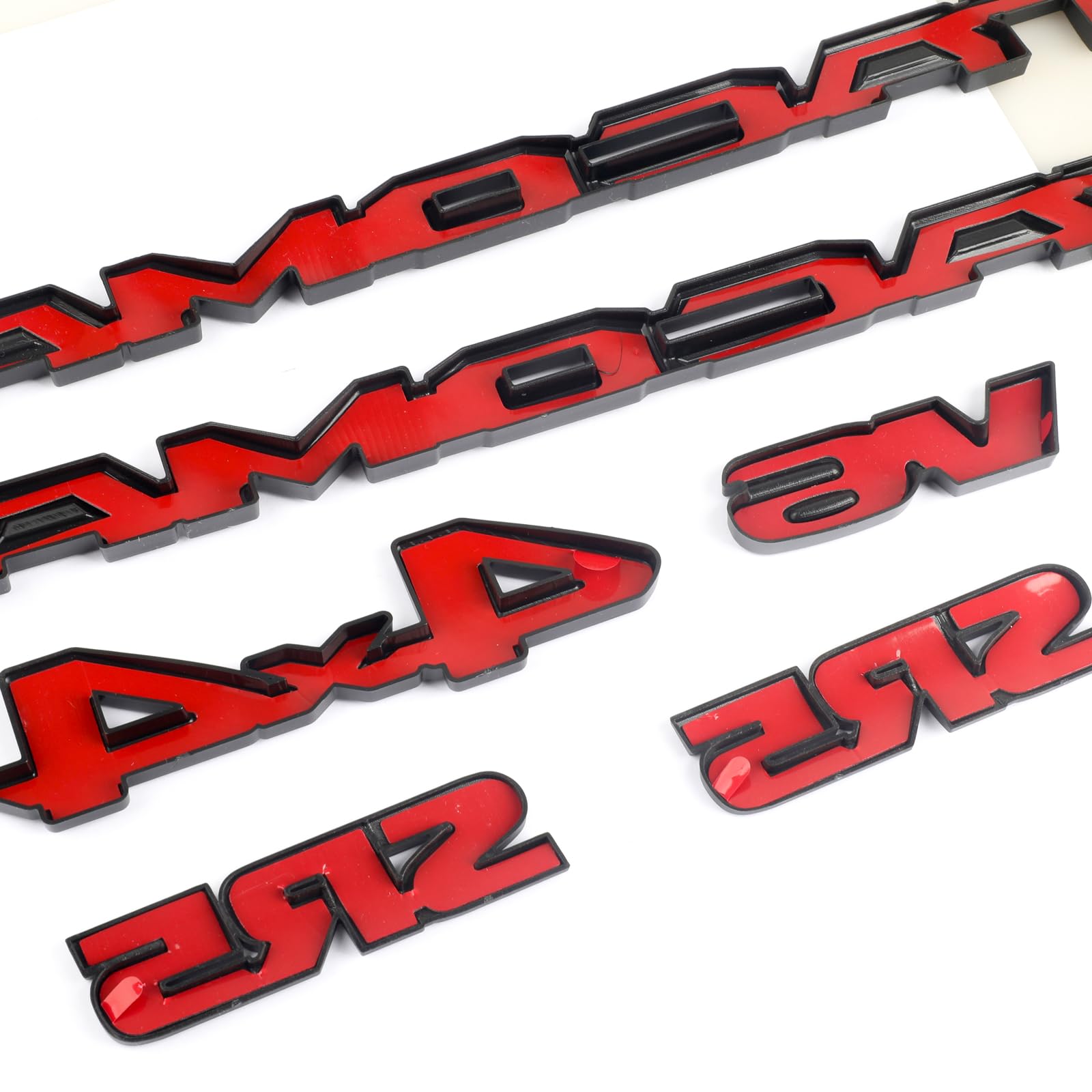 POSPICE adhesive-backed emblem overlay applied to the Tacoma badge for a secure fit.