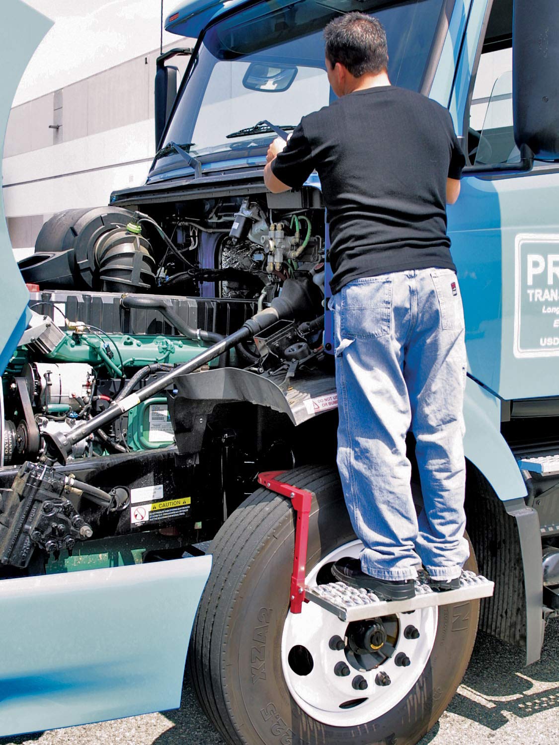 Powerbuilt Tire Step folded flat for compact storage in a vehicle