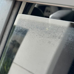 PROJE' Water Spot Remover on glass surface removing stubborn stains.