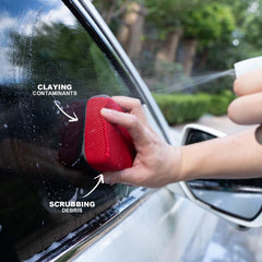 PUMBAA HOME clay sponge in use on a car panel during detail session.
