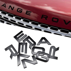 QOMAGO car emblem on matte black front hood and trunk, enhances style and durability.