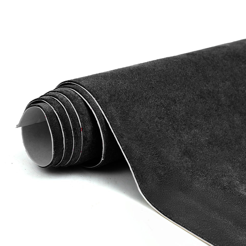 RadiantDecor premium black suede wrap close-up texture for luxurious car interior.