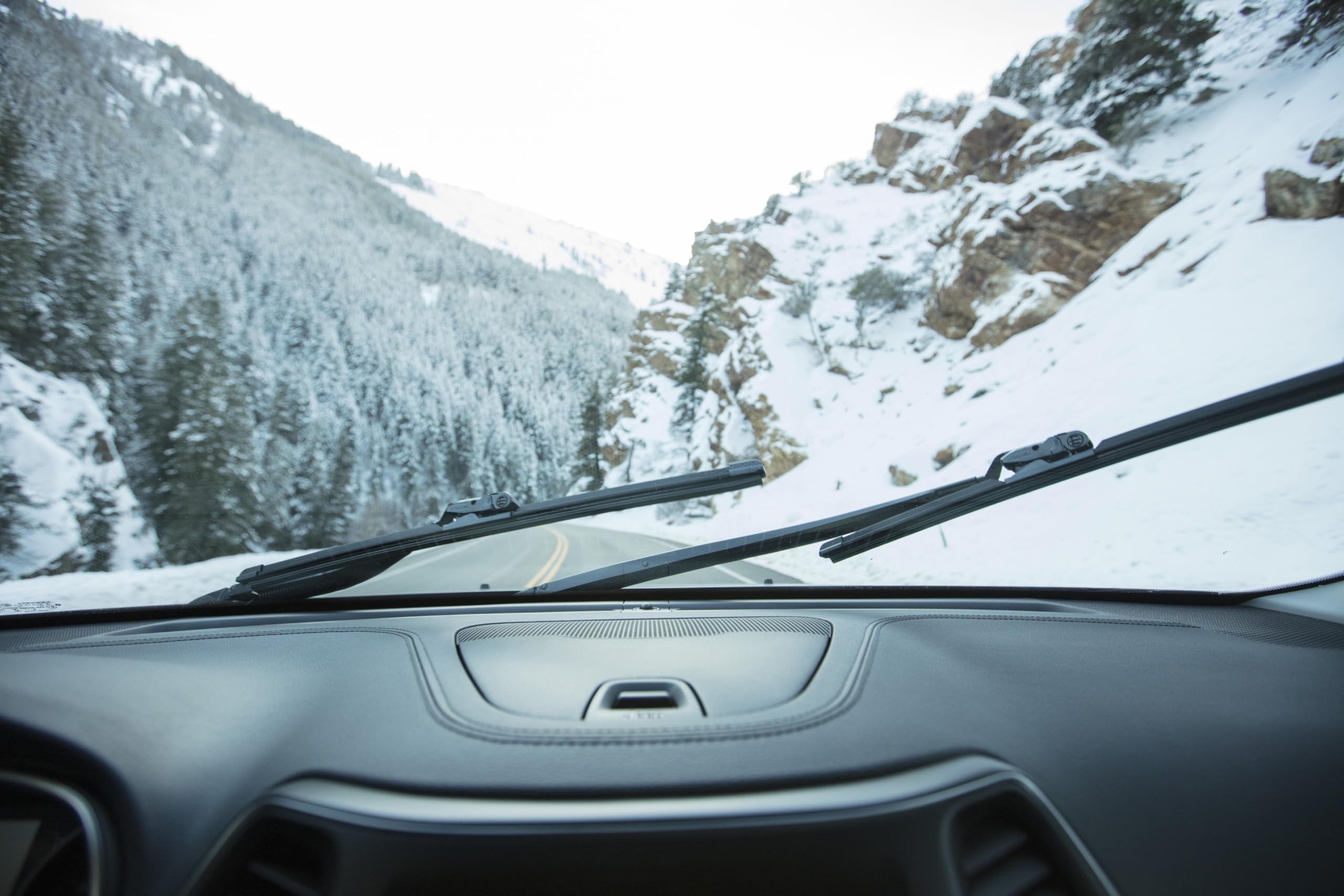Rain-X aerodynamic spoiler design reduces wind lift for steady contact.