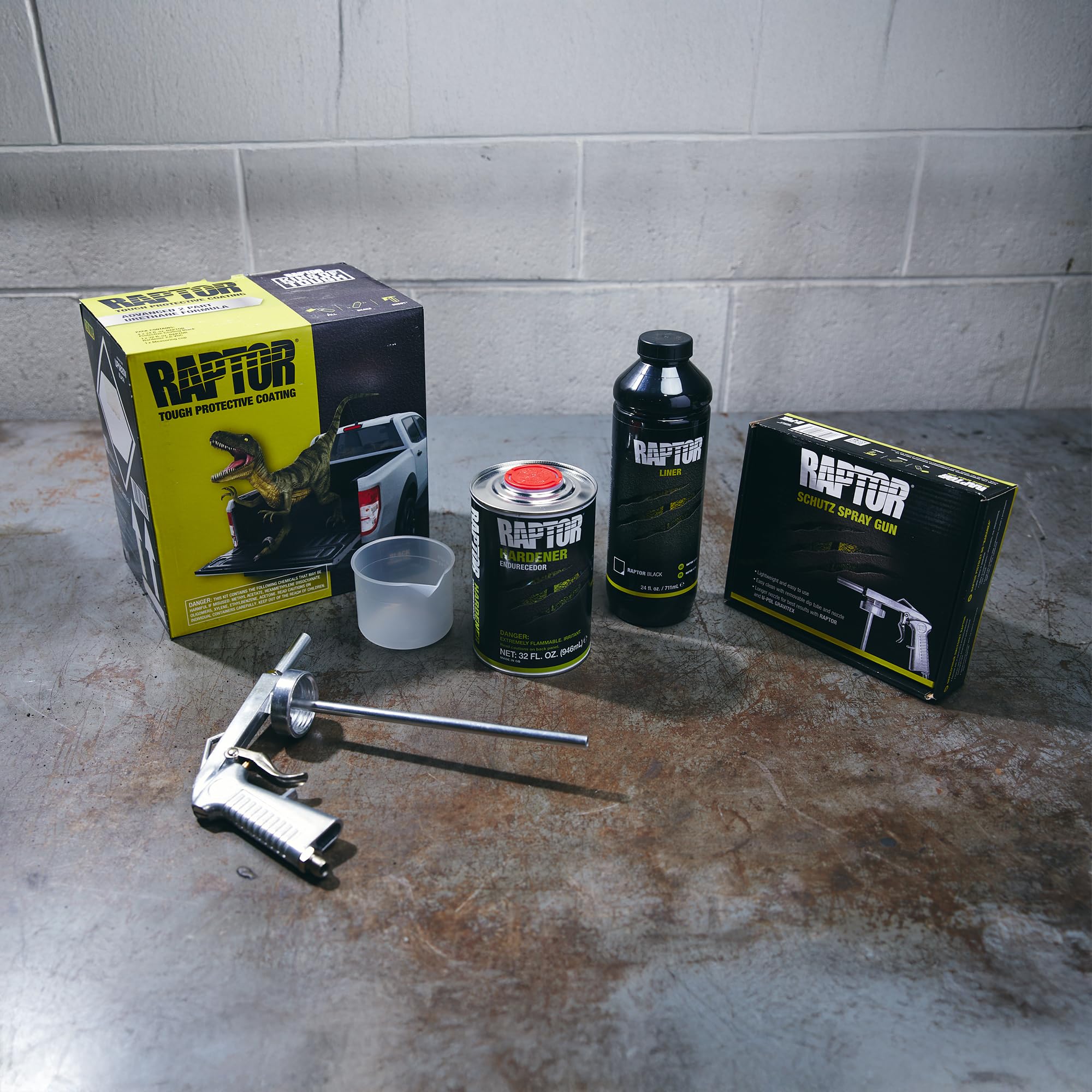 Raptor hardener bottles included for a fast-curing 2K urethane bed liner system.