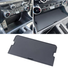 RAVOTOM center console cover over the front pocket keeps items secure.