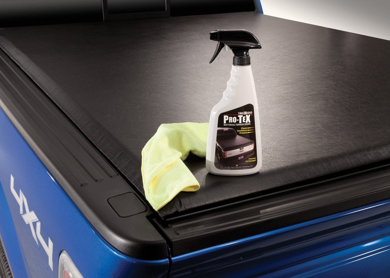RealTruck TruXedo Pro-TeX spray demonstrates easy application and protection on a cover.