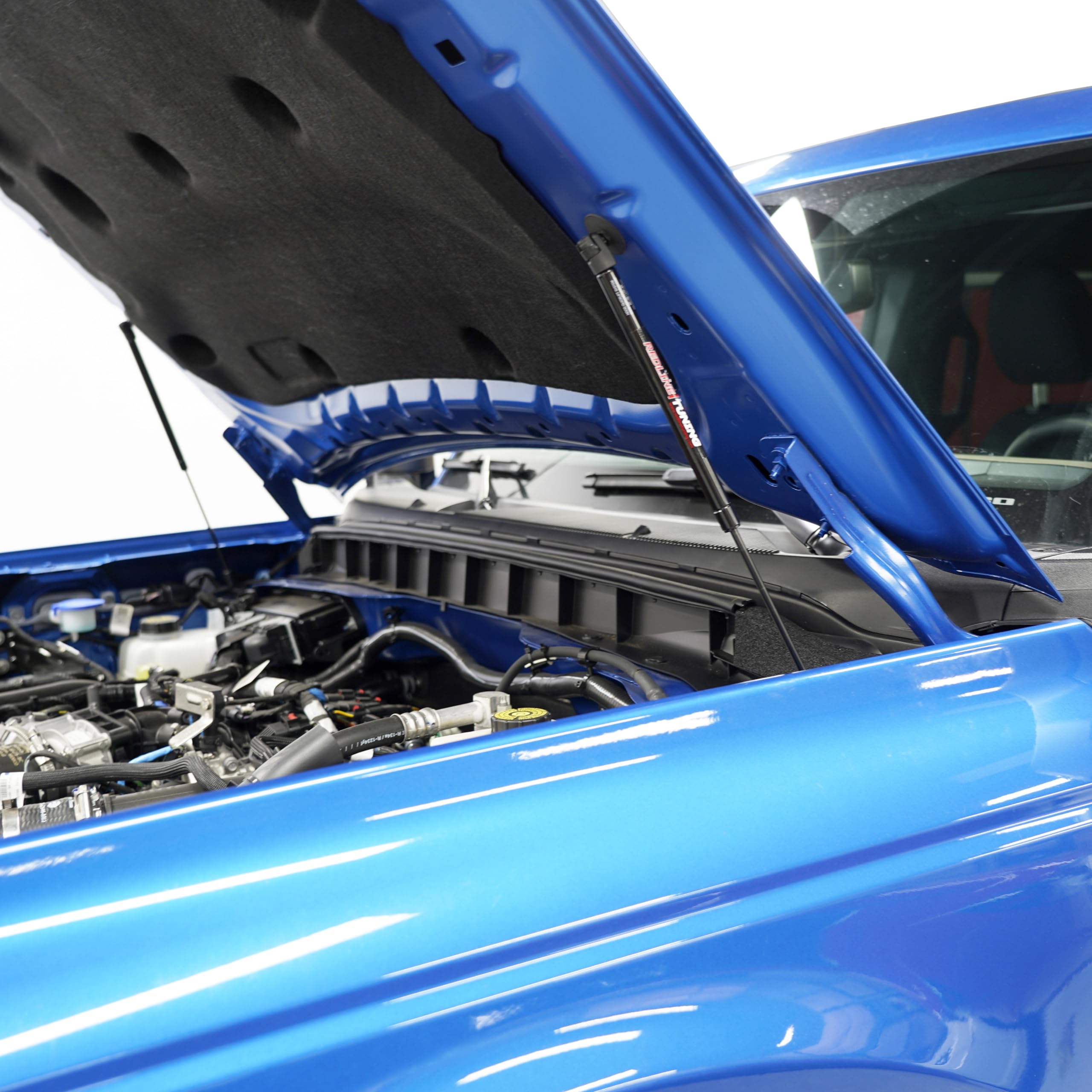 End-of-stroke dampening slows final hood travel for protection.