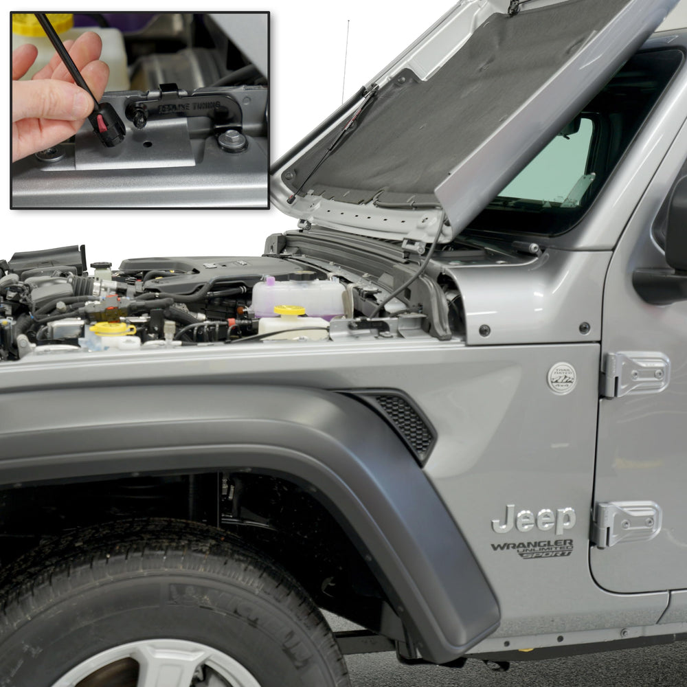 Quick-release lower attachments demonstrate easy hood detachment from gas struts.
